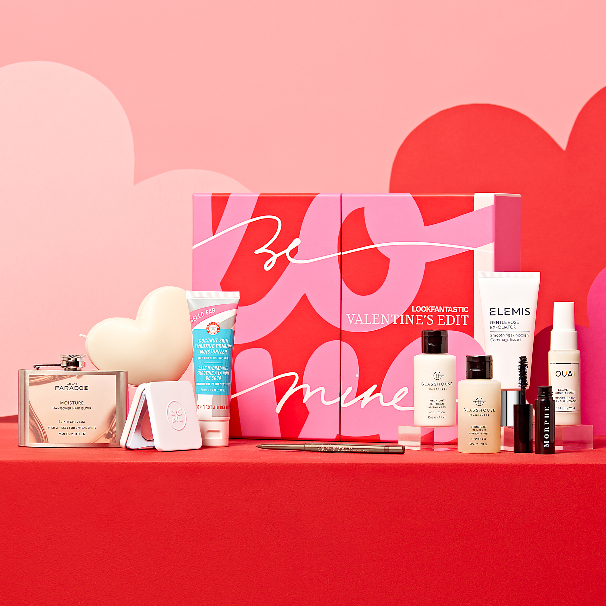 The Look Fantastic Valentine's Edit. Box and its contents in a pink and red studio setting
