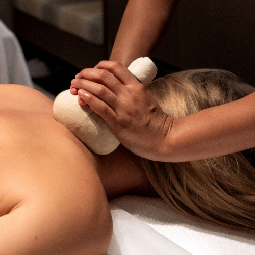A woman gets a hot stone massage