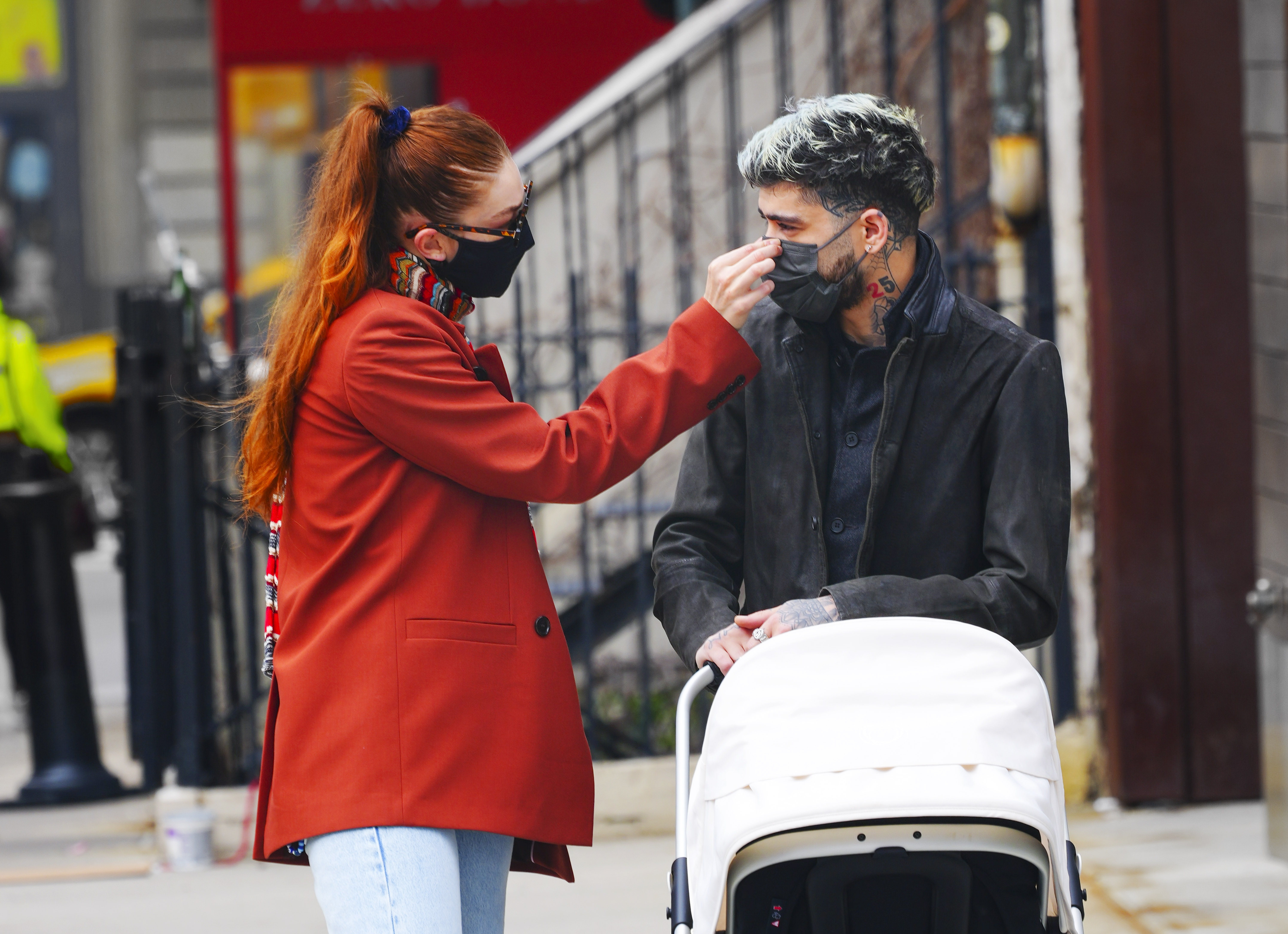 Gigi Hadid and Zayn Malik walking daughter Khai