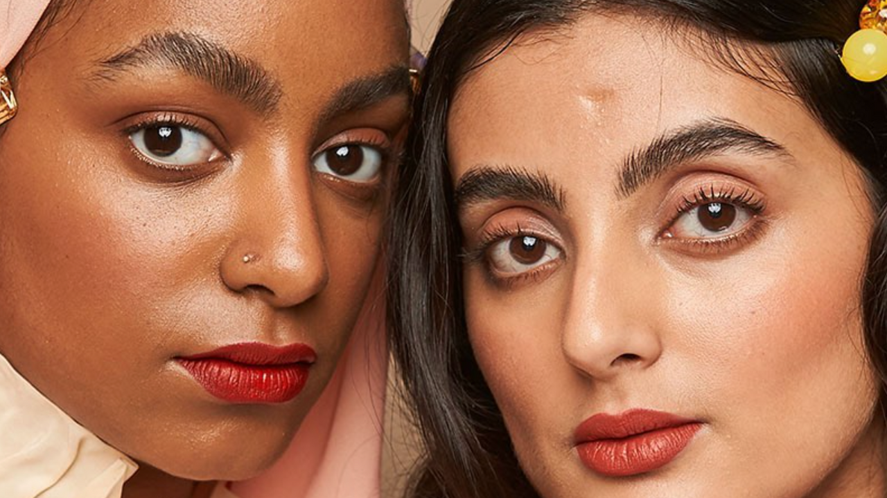 Halal beauty: Two female models pose with red lipstick on in a close-up crop