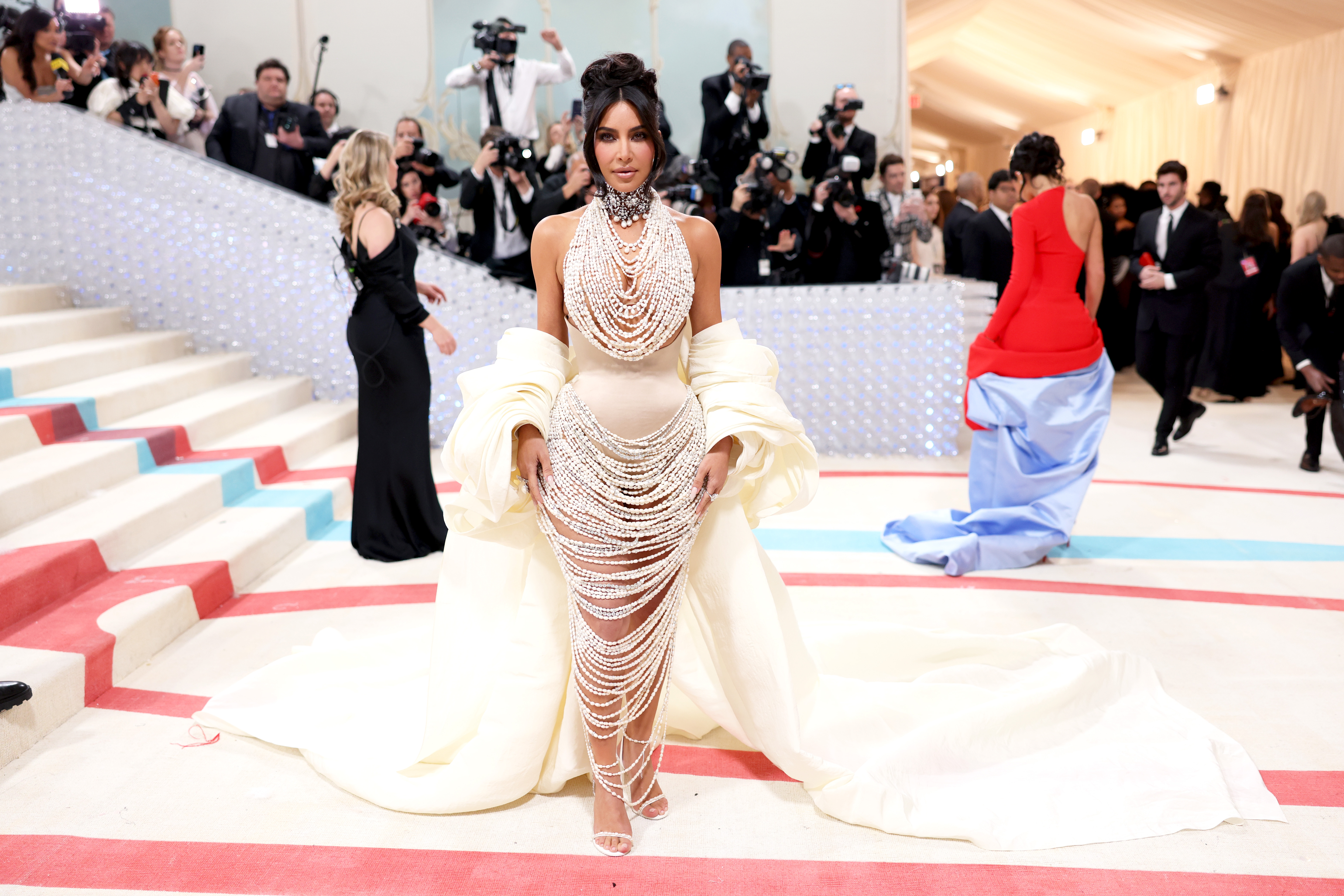 Kim Kardashian Arrives At The Met Gala 2023 Dripping In Pearls