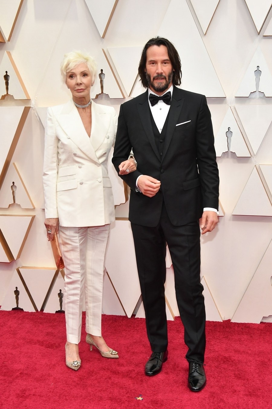 Patricia Taylor y Keanu Reeves Oscars 2020