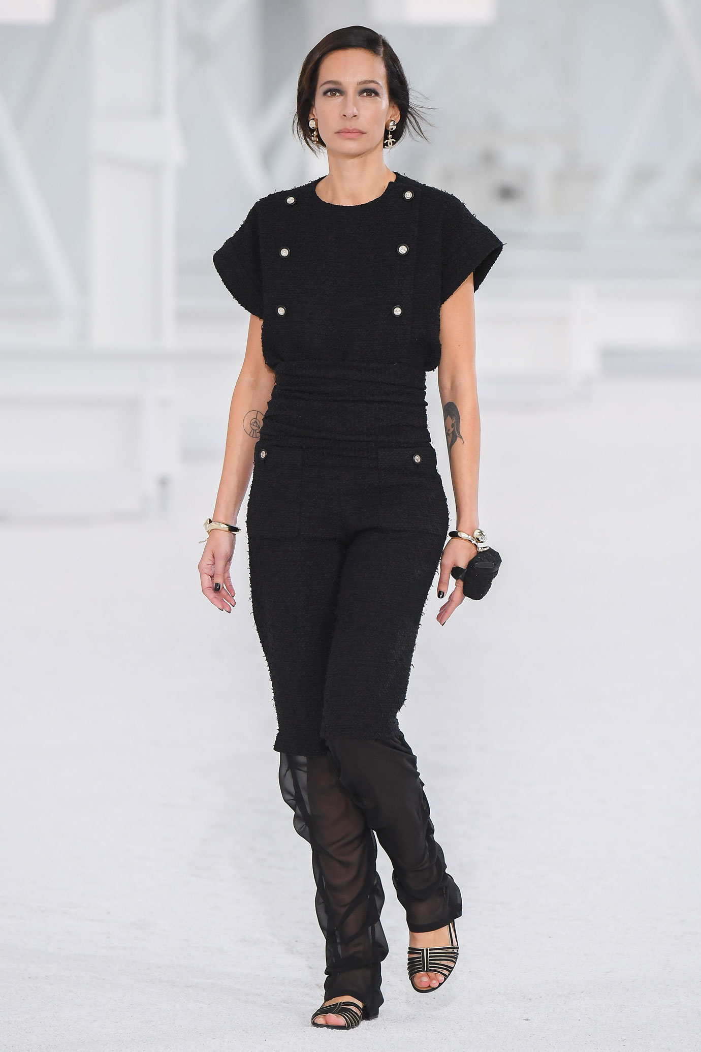 Model on the Chanel catwalk wearing all black during the women's Spring/Summer 2020/2021 collection show.