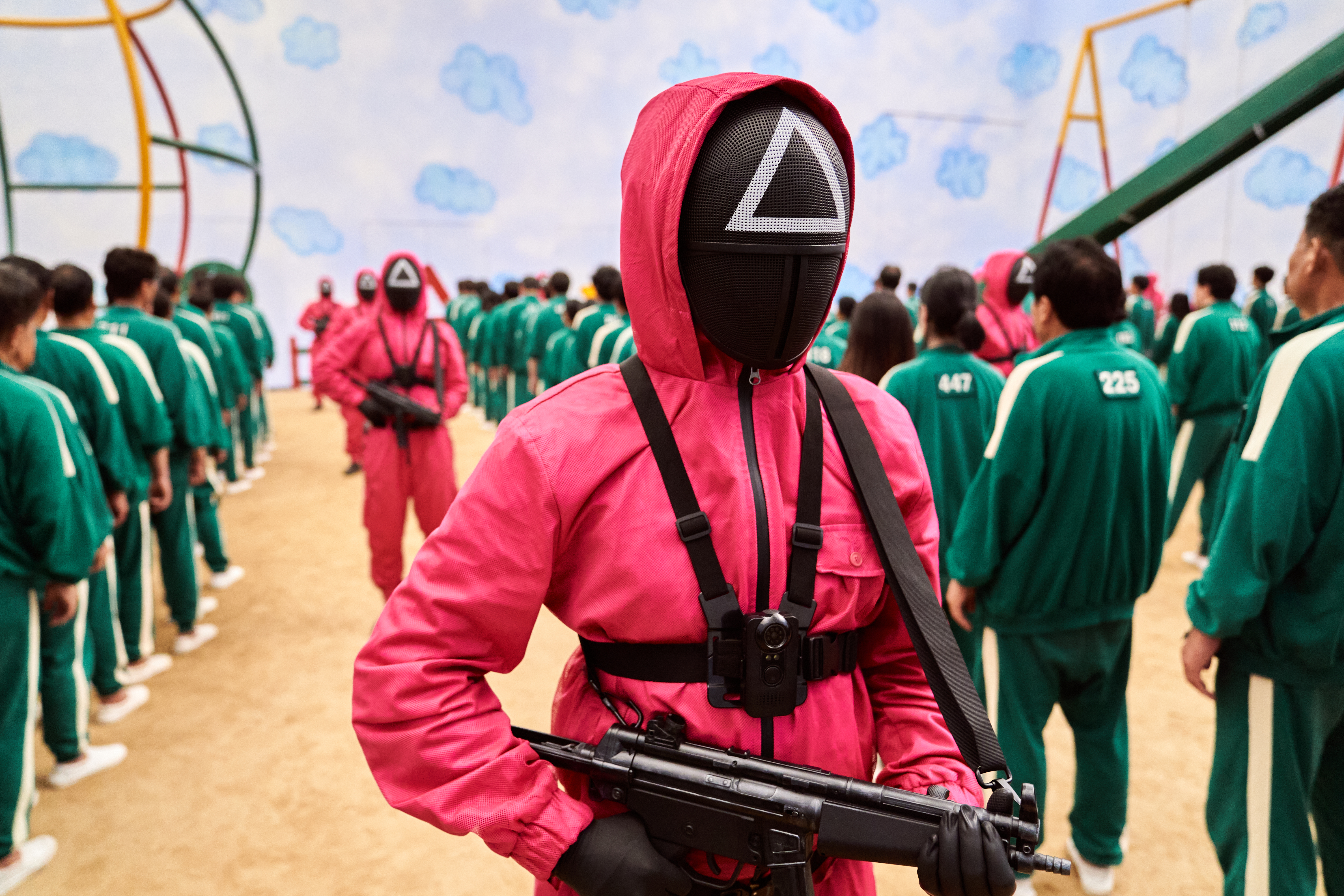 A masked guard in <i>Squid Game</i> 