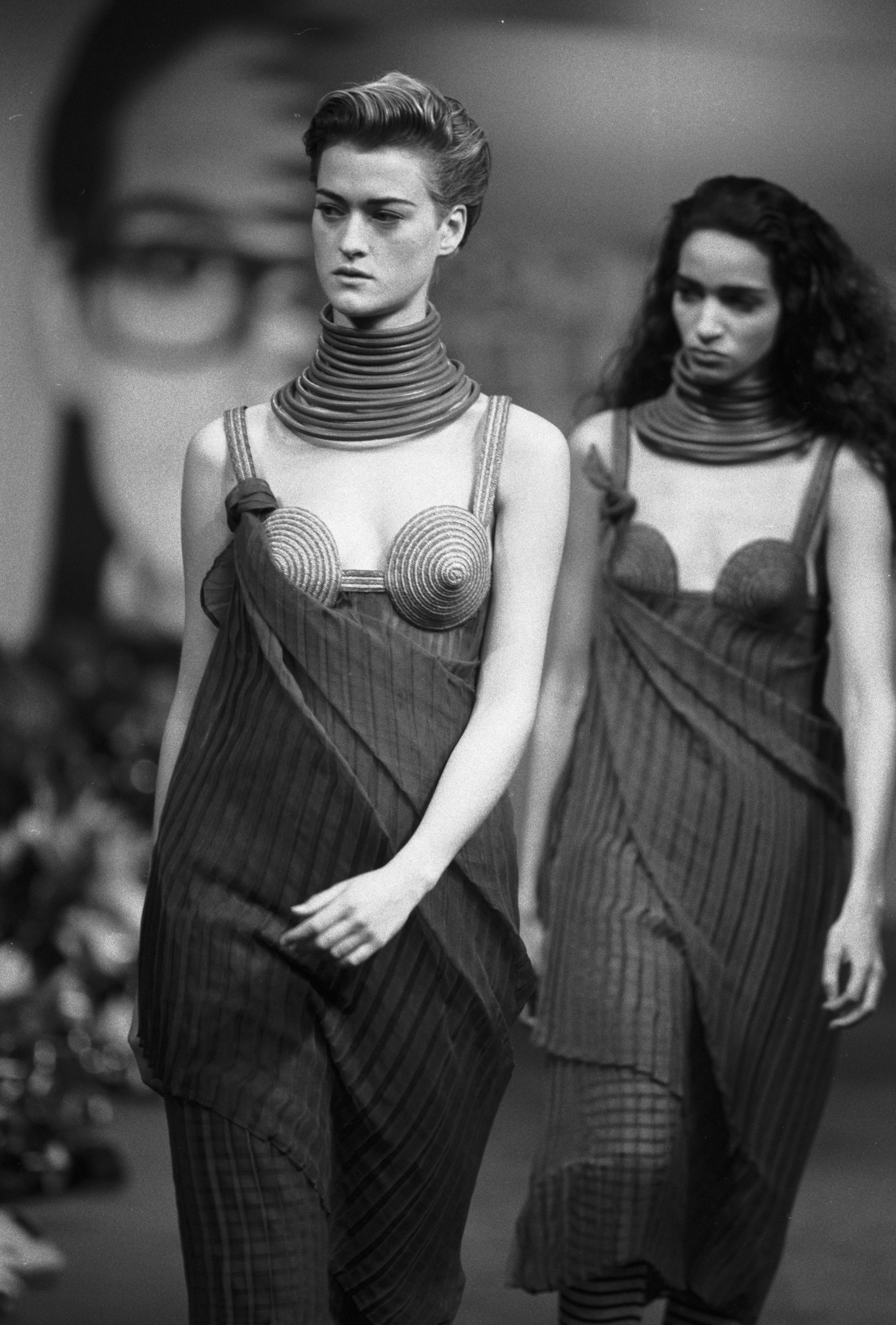 The rarest Jean Paul Gaultier bondage cone-style bra with cutout detailing  from the spring 1993 runway collection. Swipe and tap to shop