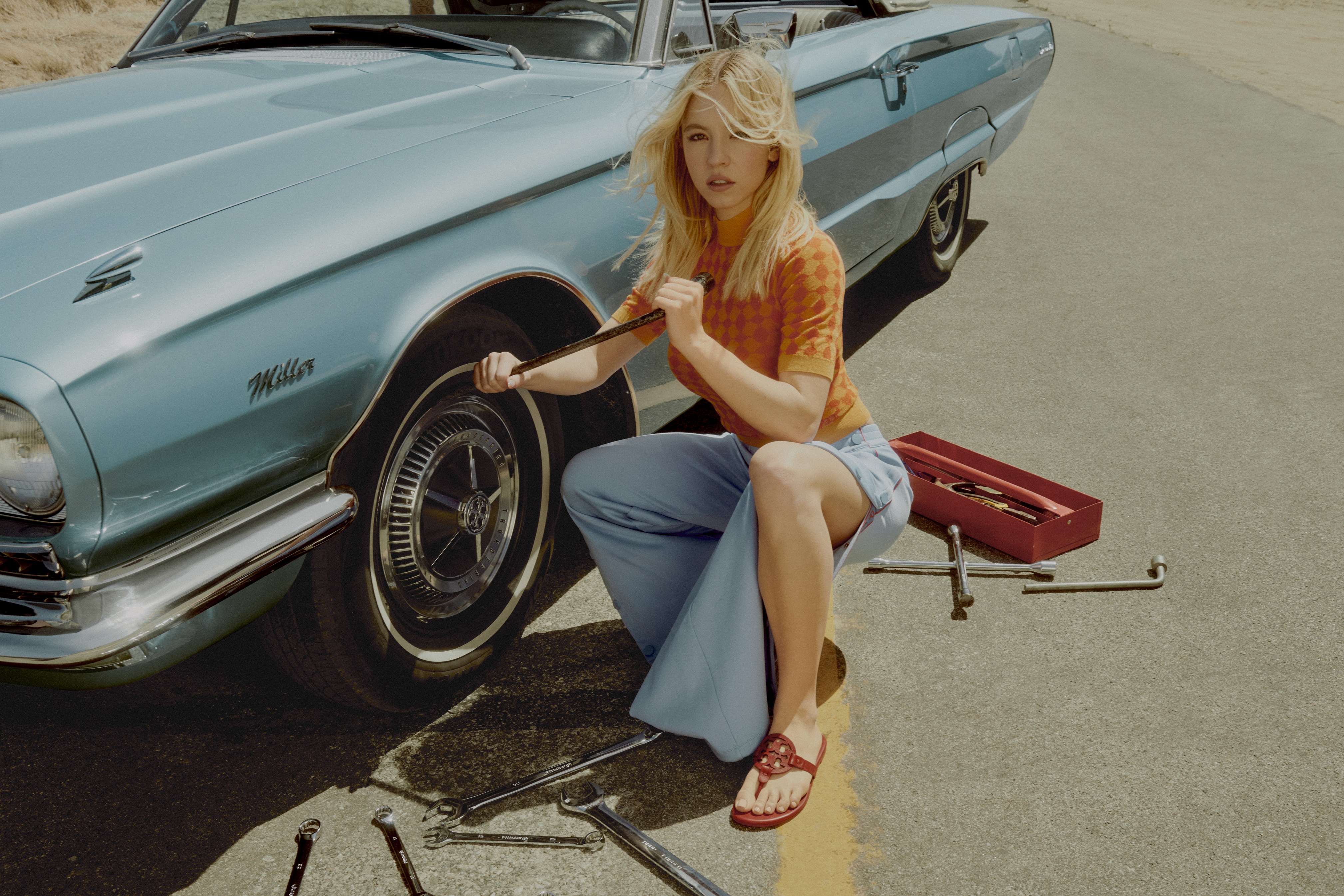 Sydney Sweeney Fixes Up a Car in New Tory Burch Campaign