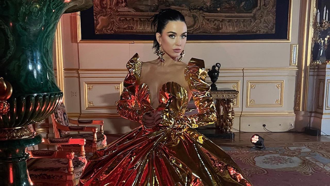 Katy Perry Wears Gold Gown By Vivienne Westwood at Coronation