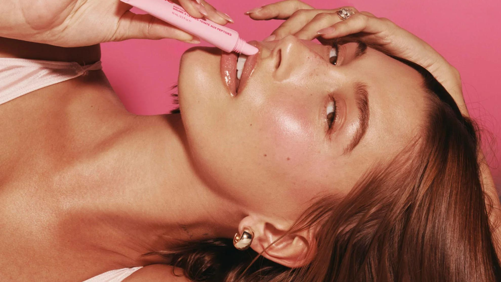 Hailey Bieber's viral Rhode Tinted Lip Balm for a natural, moisturized look.