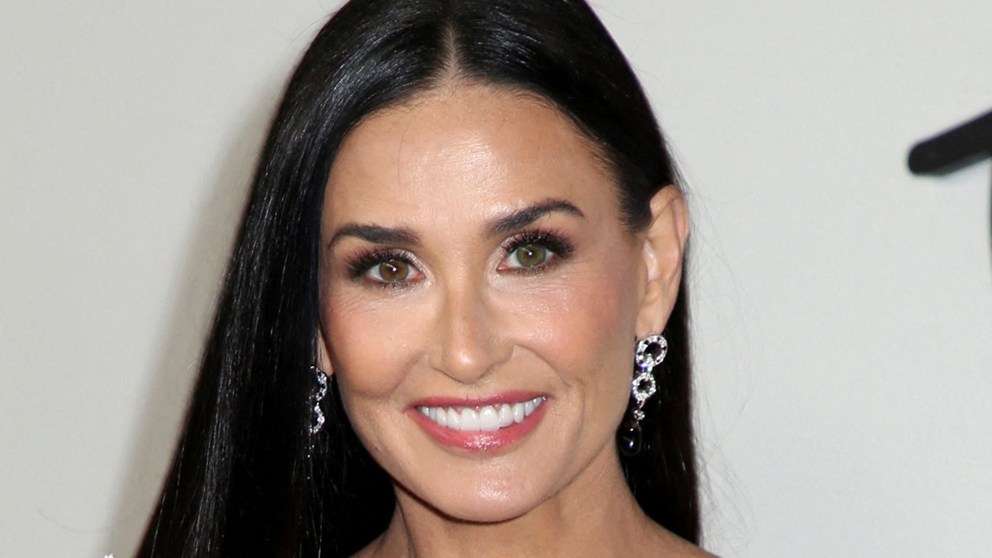 Demi Moore at Fashion Week: a beacon of timeless elegance and bold, age-defying style.