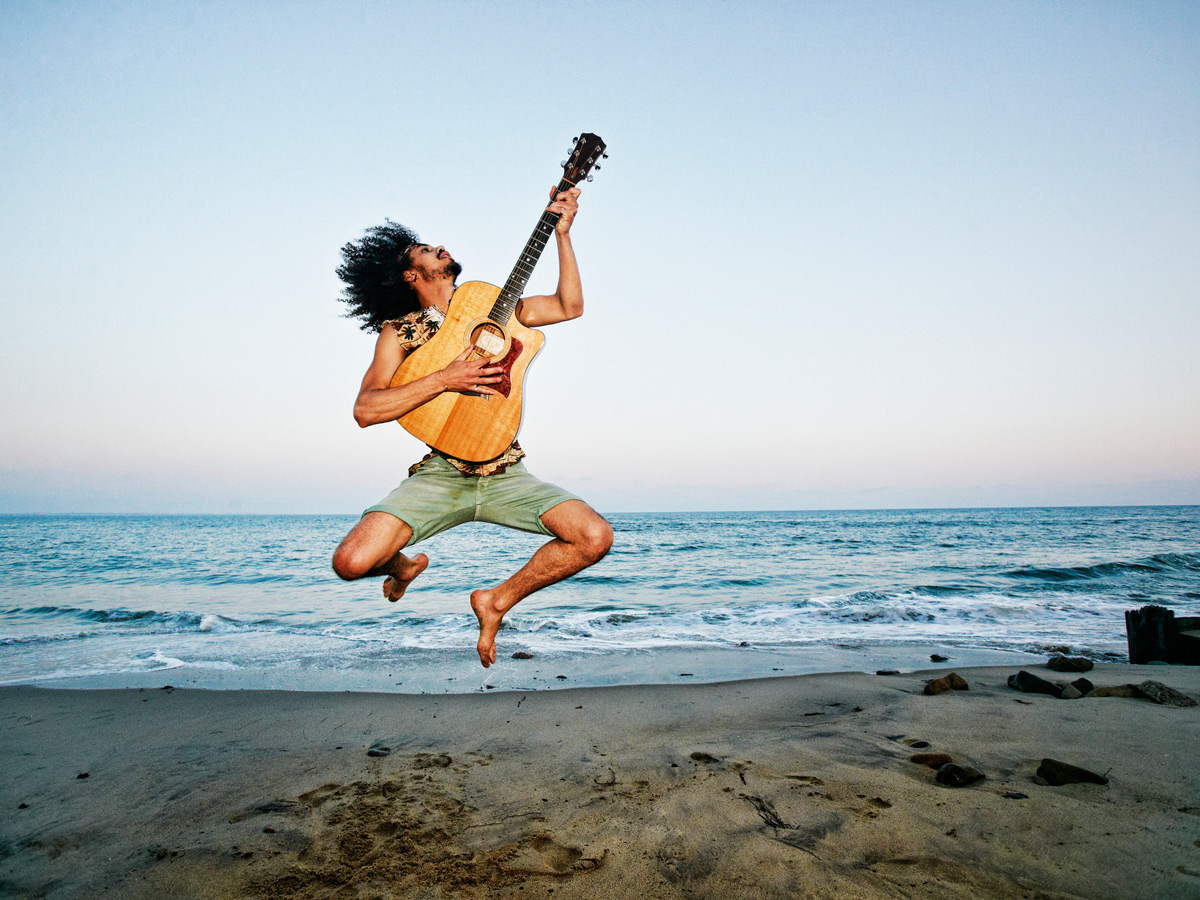 GettyImages-guitar-music-beach-man-jumping-hobby-smart