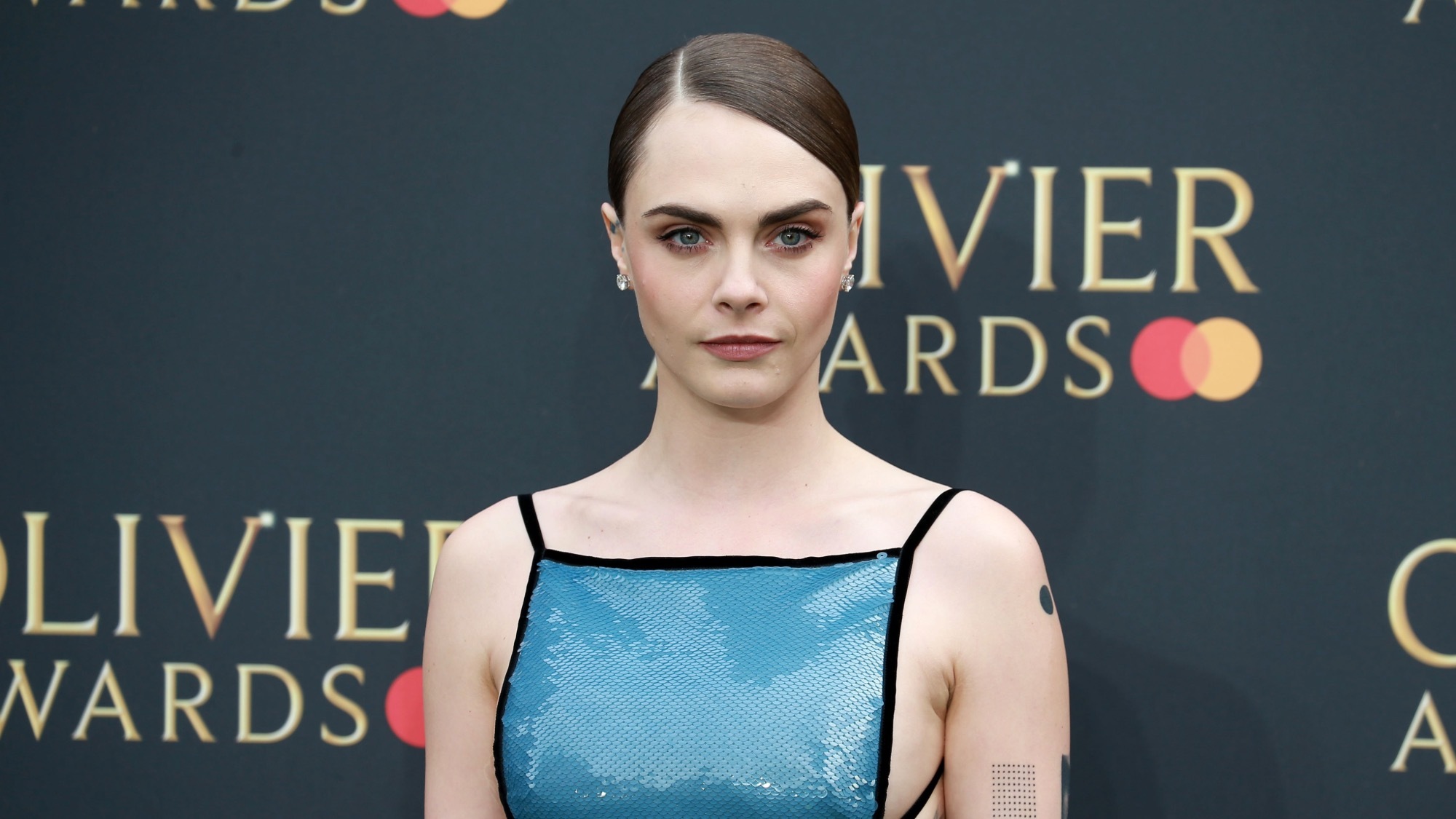 Cara Delevigne poses topless in new pride campaign.