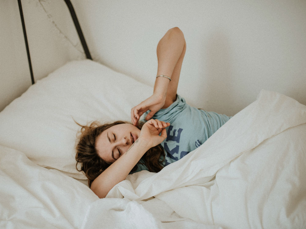 sleep-bed-woman-stress-habits-wellness