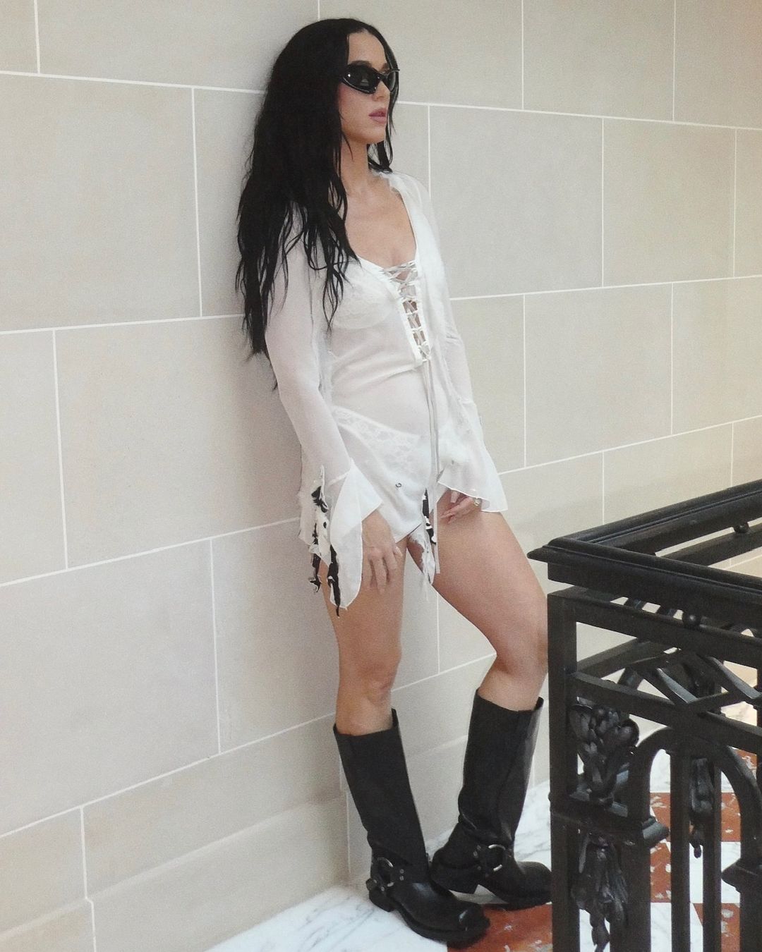 Katy Perry hides nothing under her sheer laced dress that subtly reveals her underwear.