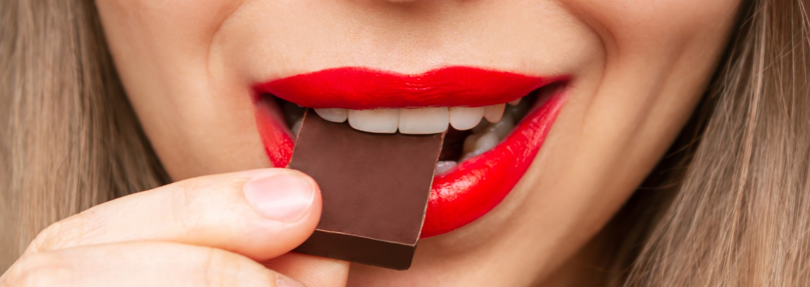 chocolate-dark-woman-lips-eating-snack-food