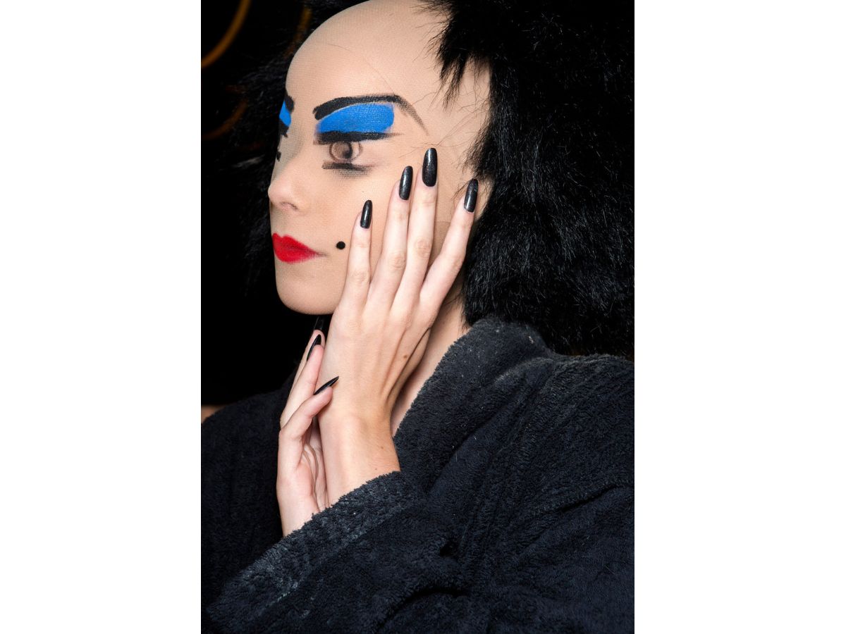 black-long-nails-on-a-face