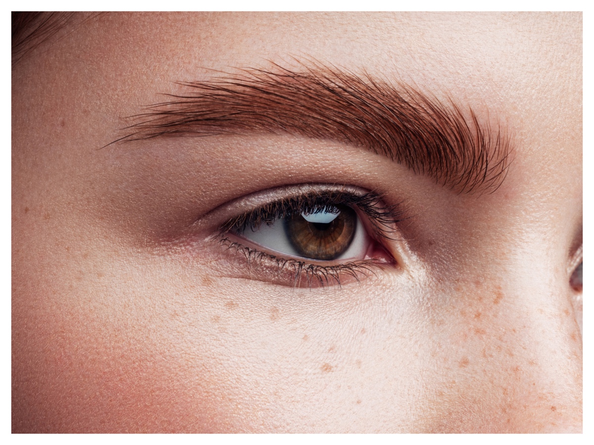 woman-looking-far-with-brown-eyebrown-and-fair-skin