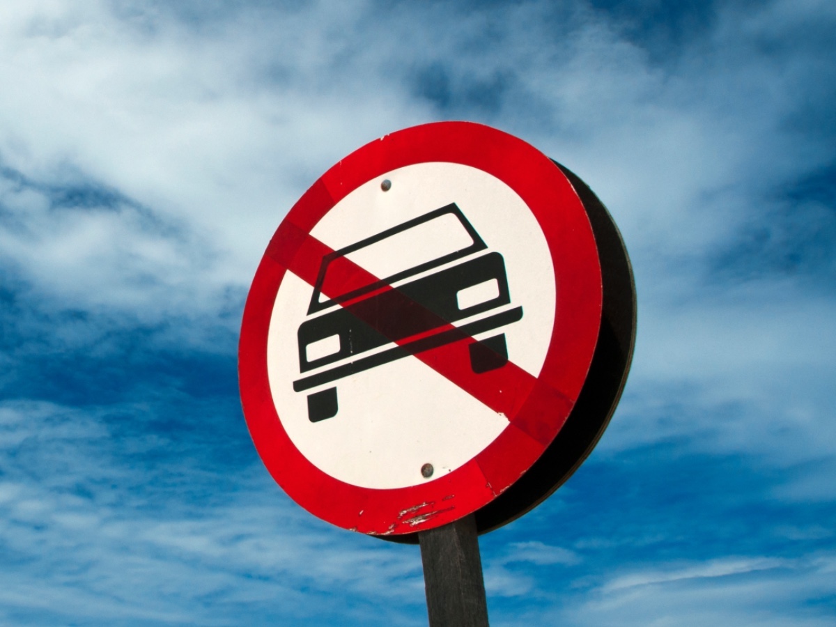 Getty-Images-signage-no-car-blue-sky