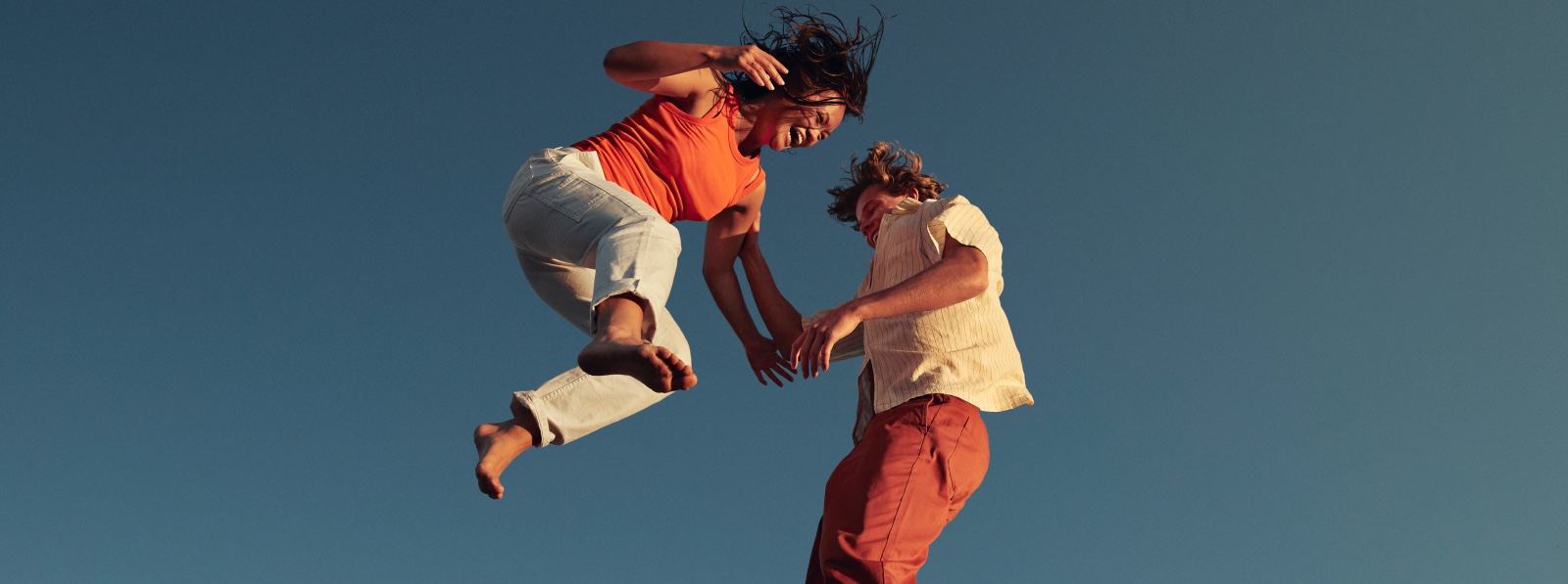 love-bombing-couple-jumping-falling-in-love