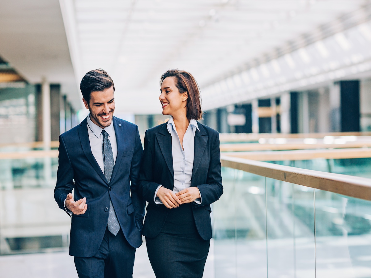 Couple-business-talking-walking-together-love-work-balance