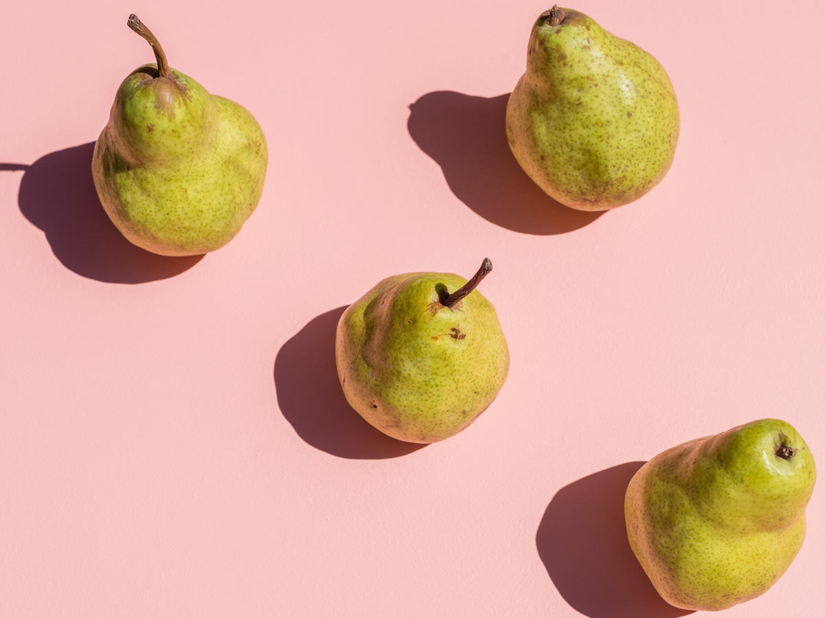 pears-on-pink-background-health-and-wellness