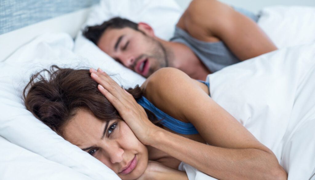 Got a partner whose snoring keeps you up? A nurse and two top doctors weigh in on the best ways to stop your partner’s snoring and help you both get some much-needed rest.