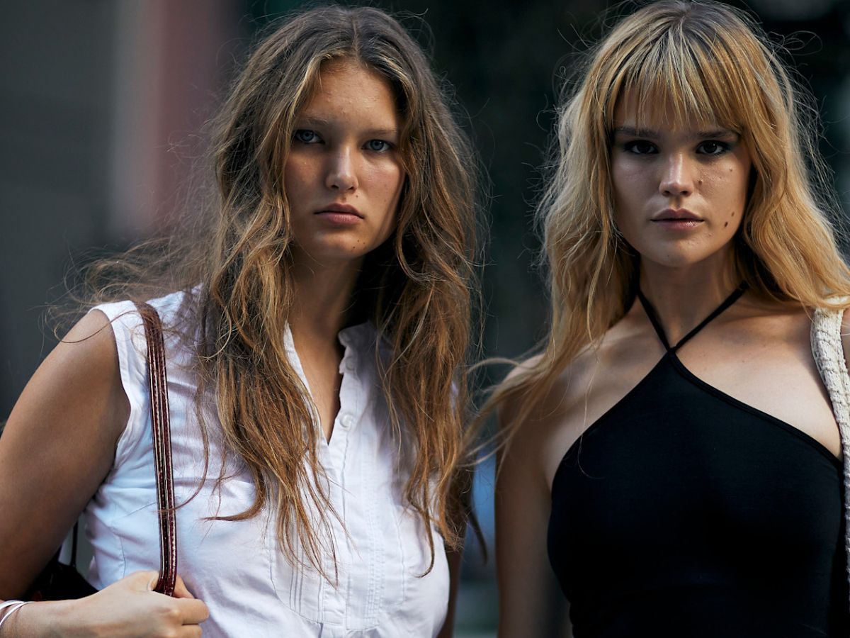 two-women-looking-at-the-camera-with-brown-blonde-hair-long