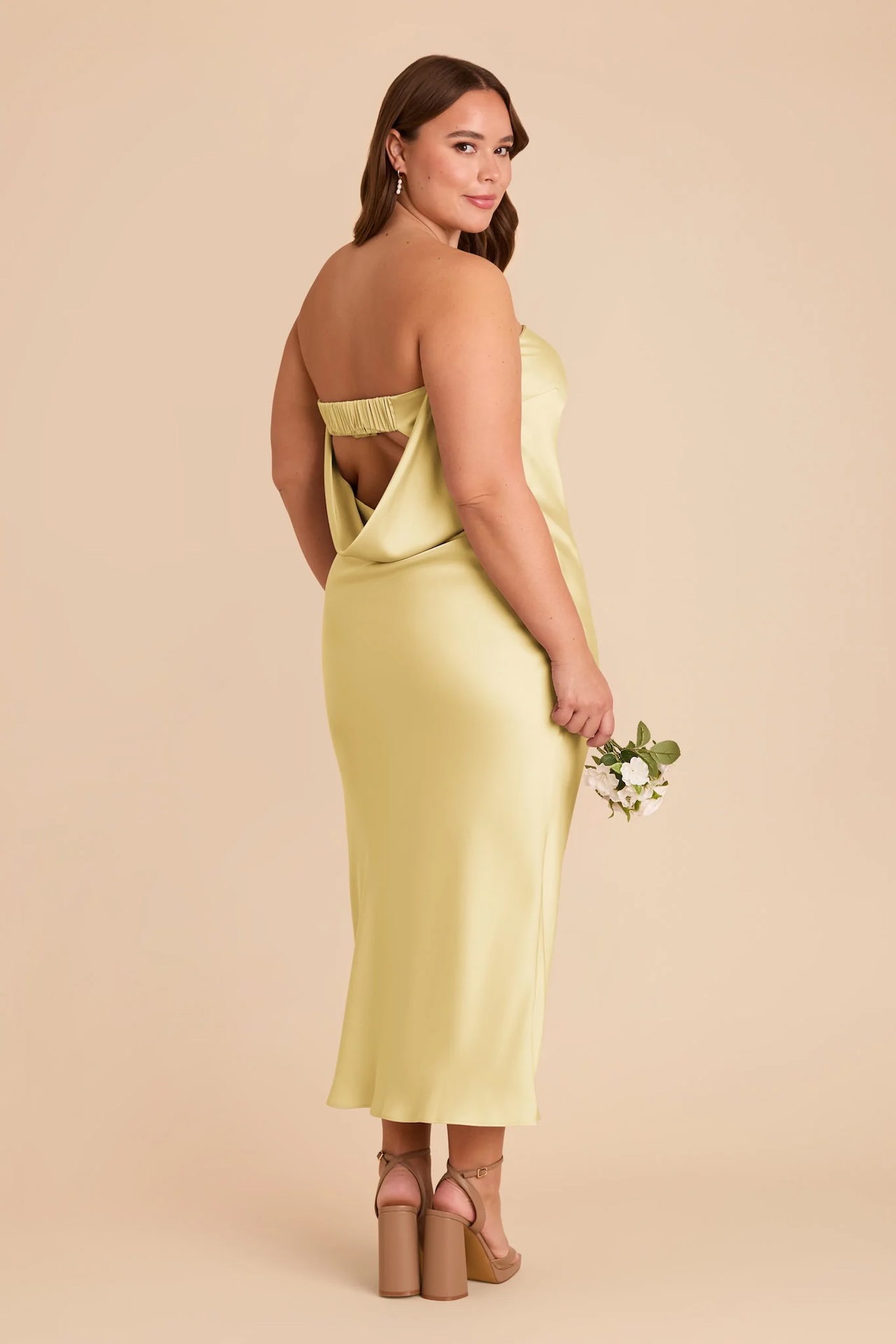 Model wearing butter yellow bridesmaid dress