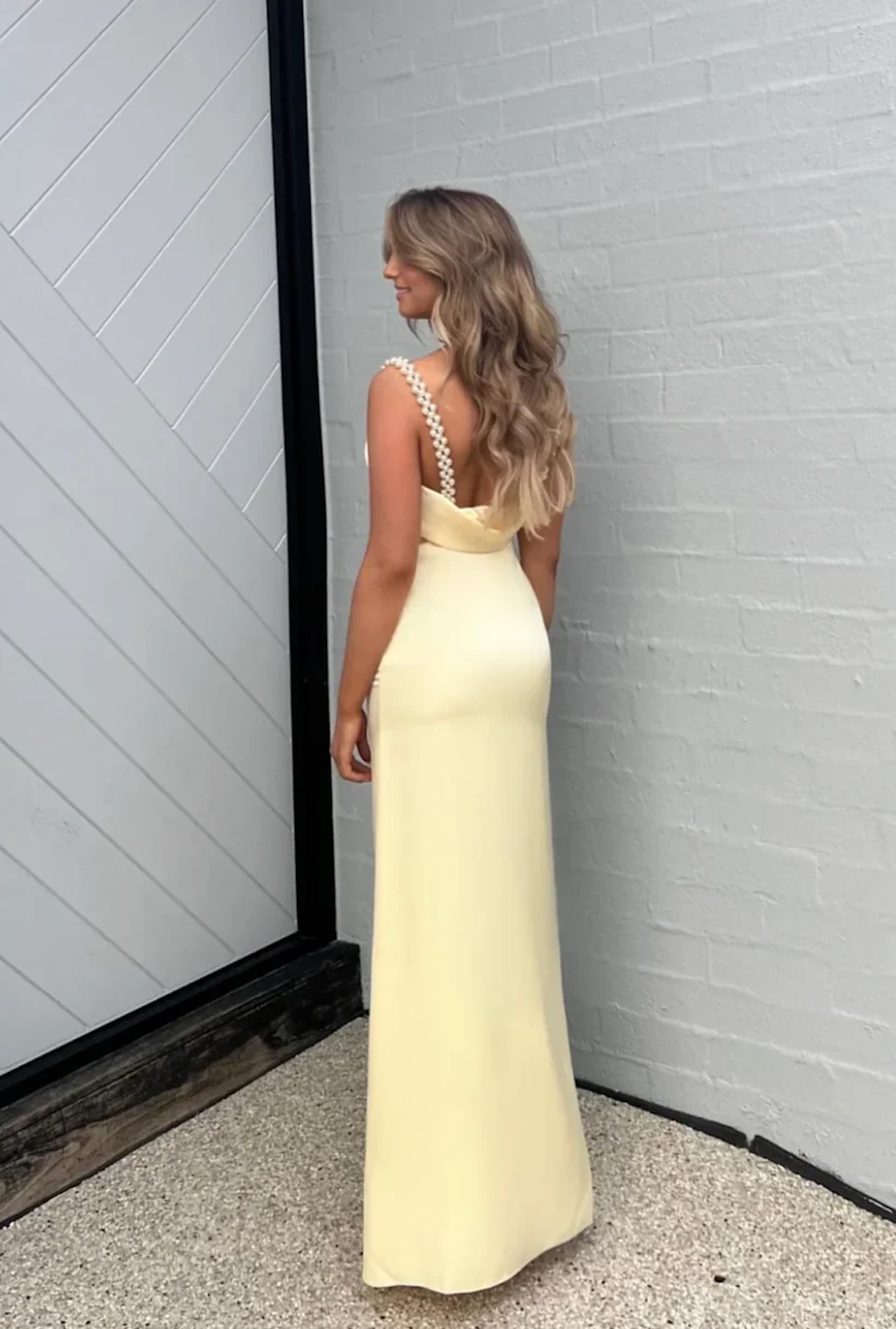 Model wearing butter yellow bridesmaid dress