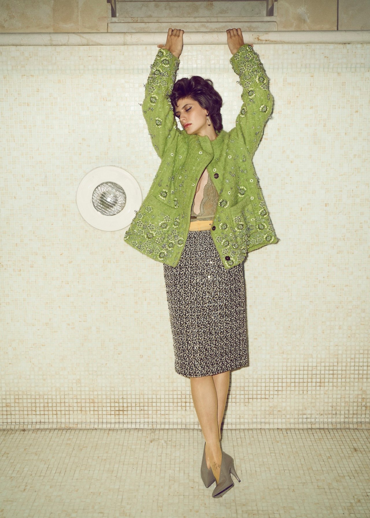 Gucci sweater, bra, skirt, shoes, gucci.com; Sodini earrings, sodini.com; Wolford tights, wolford.com.