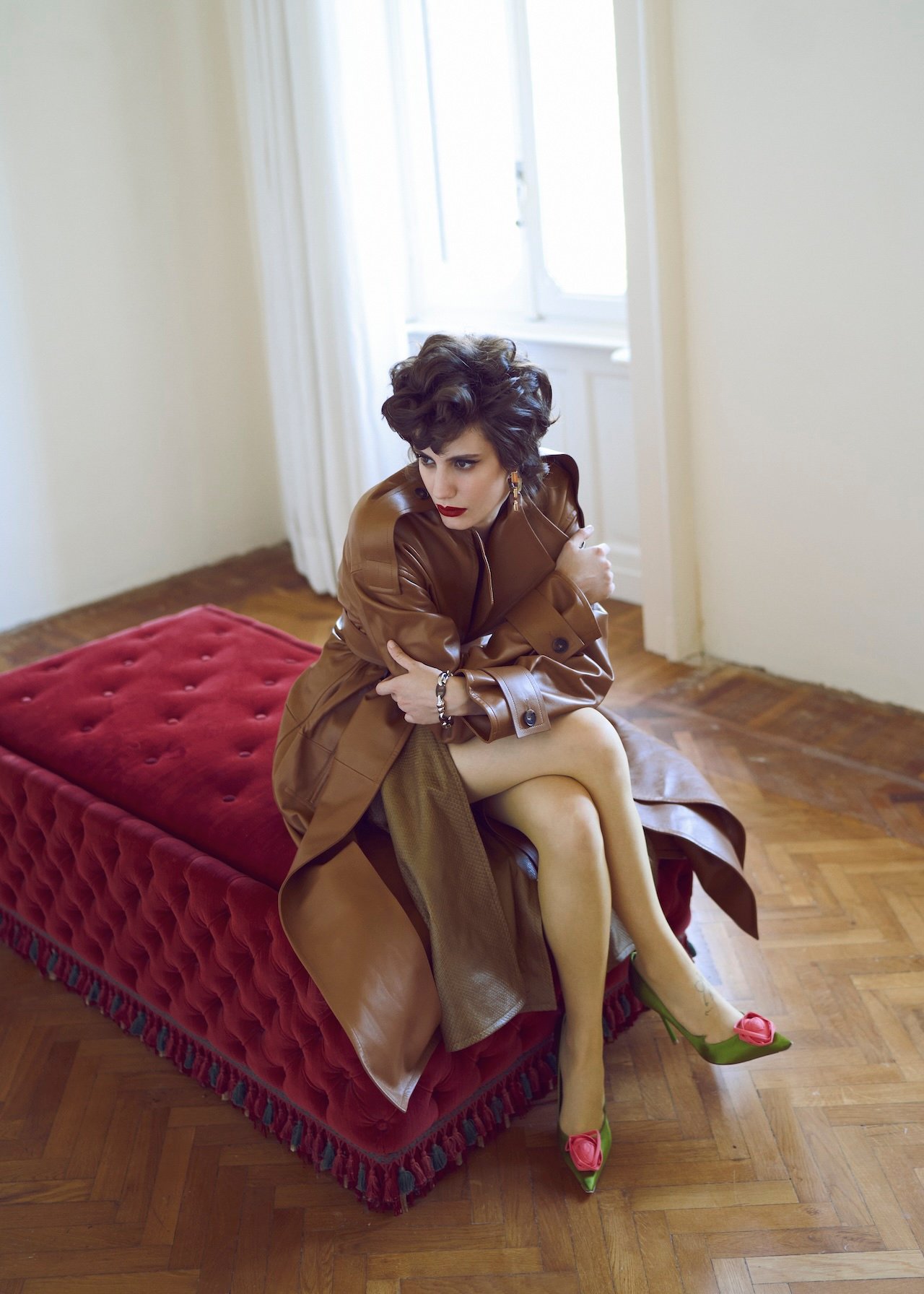 Tod’s coat, shirt, skirt, tods.com; Hermès earrings, bracelet, hermes.com; Wolford tights, wolford.com; Roger Vivier shoes, rogervivier.com.