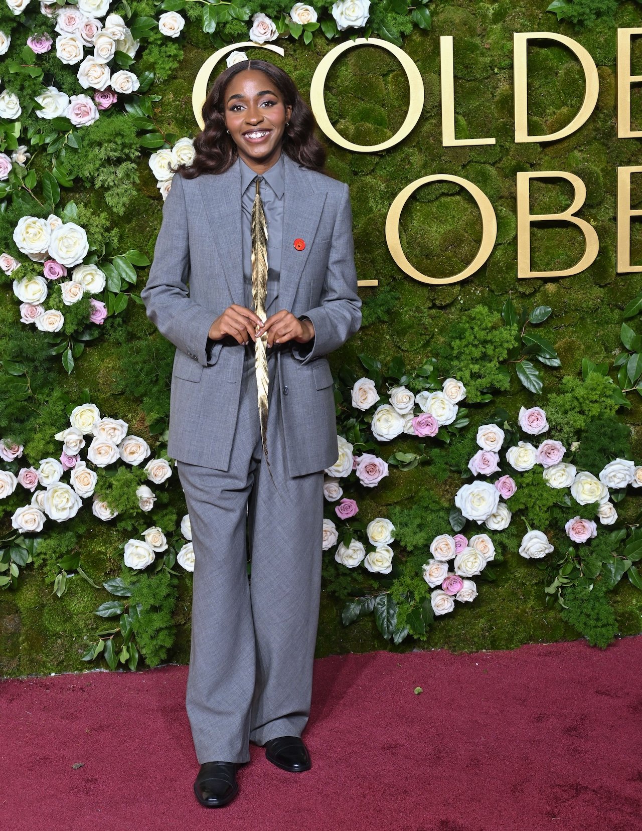 Ayo Edebiri during the 82nd Annual Golden Globes in a menswear suit