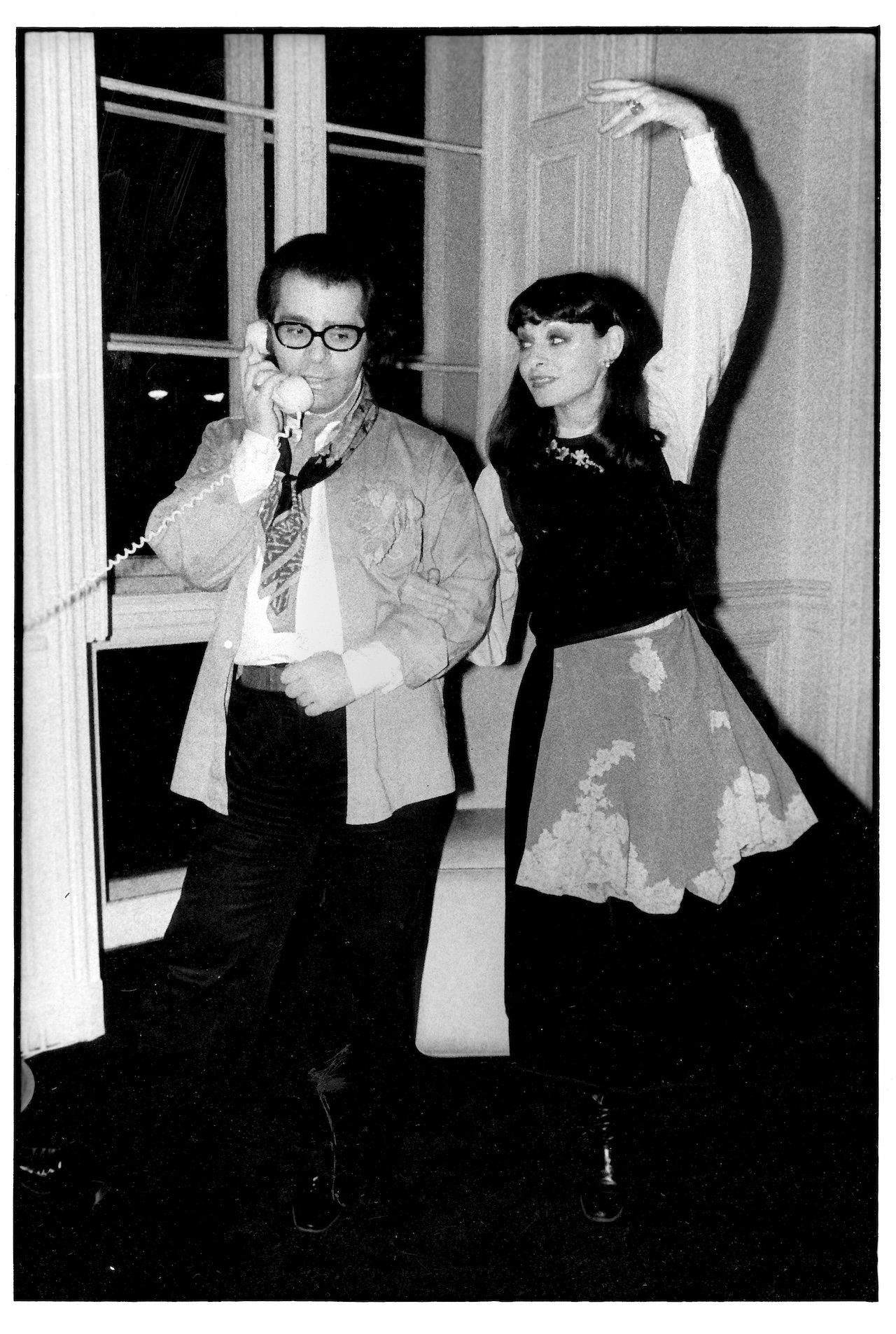 Joan Juliet Buck with Karl Lagerfeld, the mauve chiffon flea market panties draped over her YSL skirt © Michael Childers