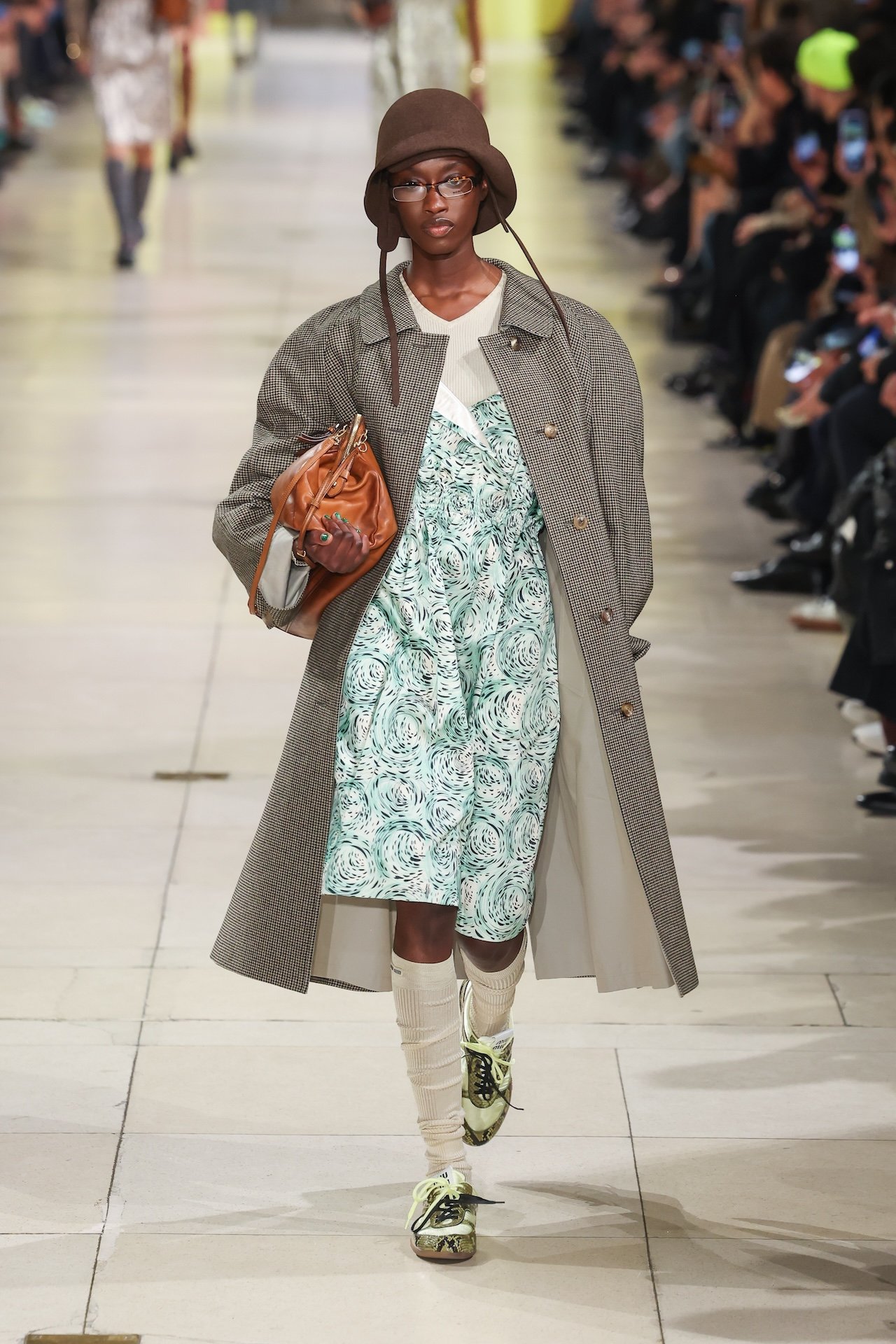 A model walks the runway during the Miu Miu Womenswear Fall/Winter 2025-2026 show as part of Paris Fashion Week
