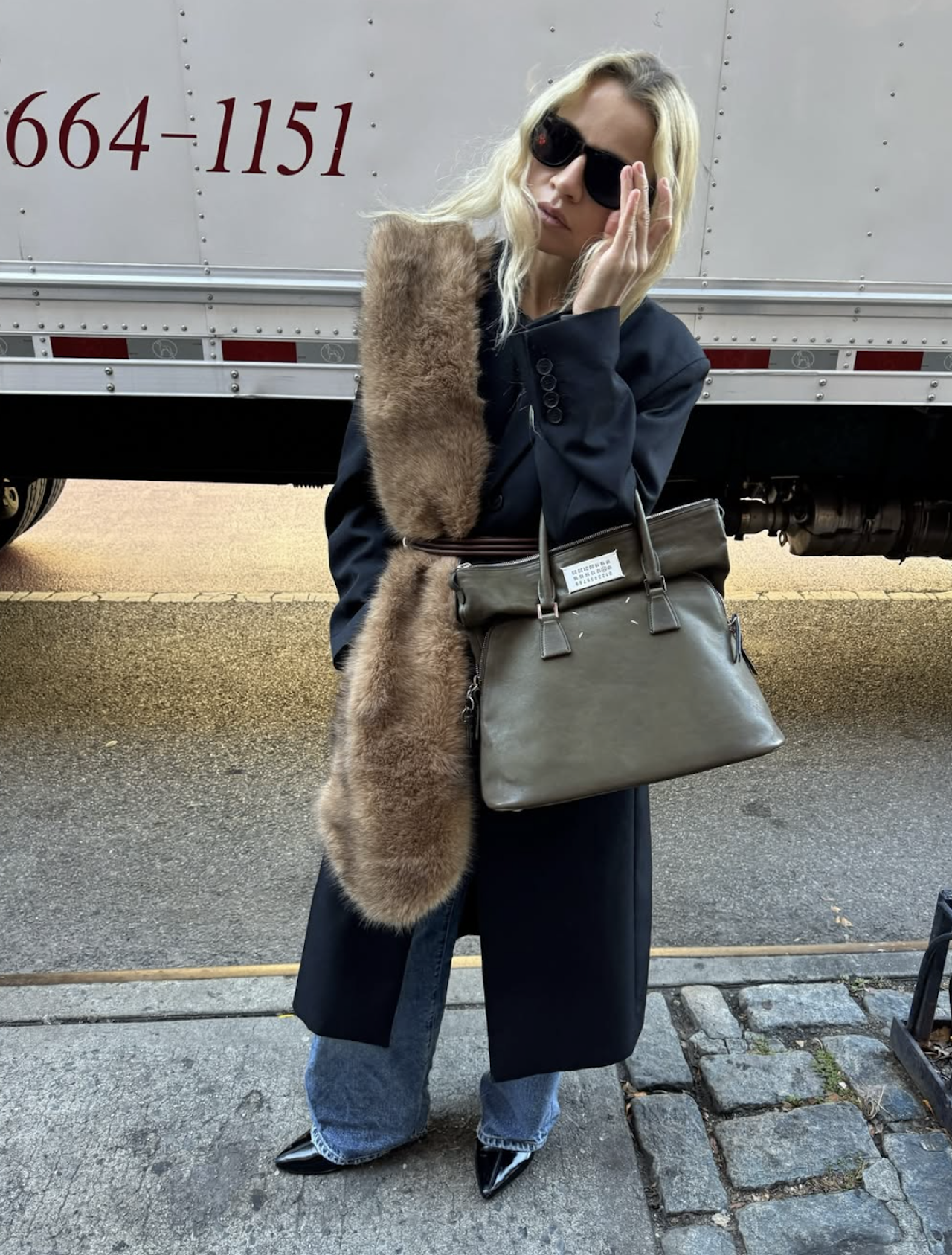 Stephanie Broek wearing fur scarf