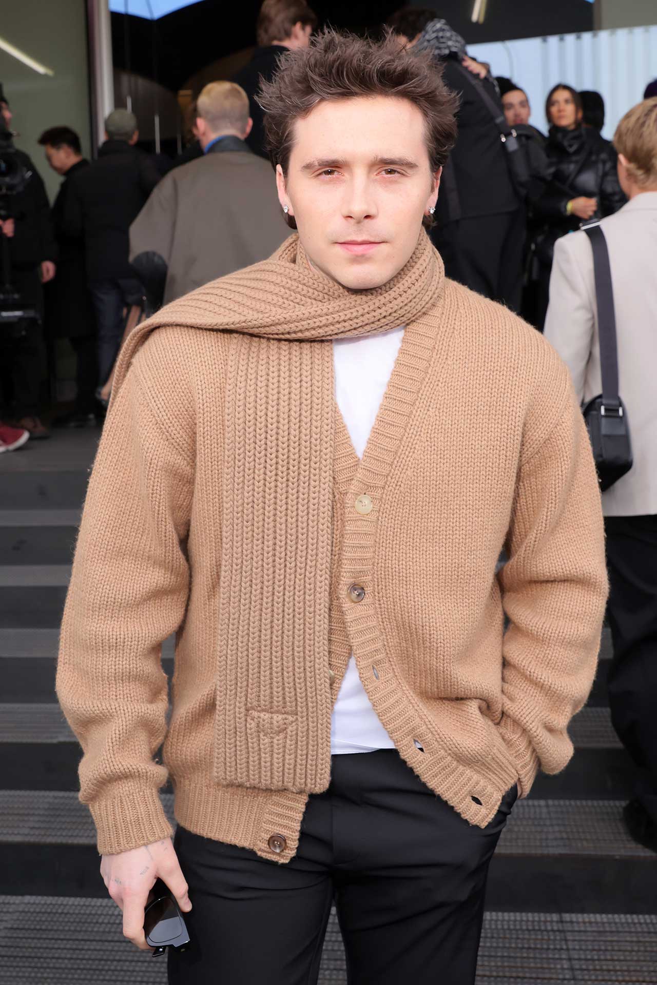 Brooklyn Beckham arrives at the Prada fashion show during the Milan Menswear Fall/Winter 2024-2025 on January 14, 2024 in Milan, Italy. 