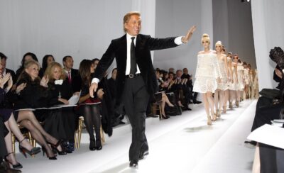 PARIS- JANUARY 22: Italian fashion designer Valentino waves as he walks on the catwalk at the Valentino Fashion show, during Paris Fashion Week Haute Couture Spring-Summer 2007 at Beaux Arts on January 22, 2007 in Paris, France. (Photo by Michel Dufour/WireImage)