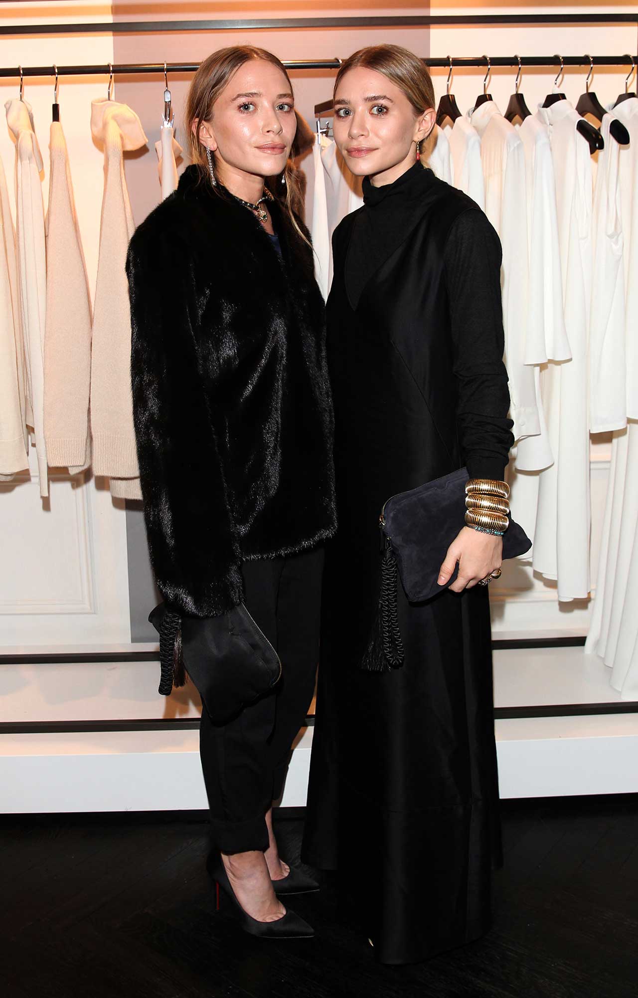 Mary-Kate Olsen and her twin sister Ashley Olsen pose during Mary-Kate Olsen and Ashley Olsen present their collection 'The Row' at Marion Heinrich on November 20, 2014 in Munich, Germany.