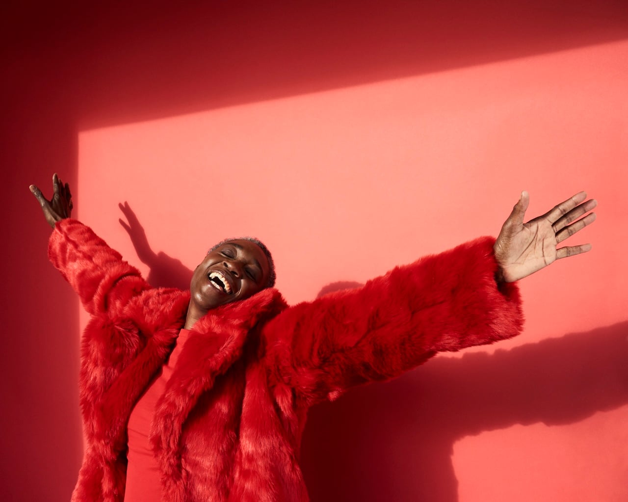 Portrait of mature woman laughing; Psychology of the happiest women and their mindset on aging