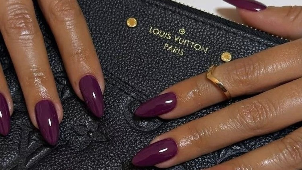 berry nails on Louis Vuitton bag