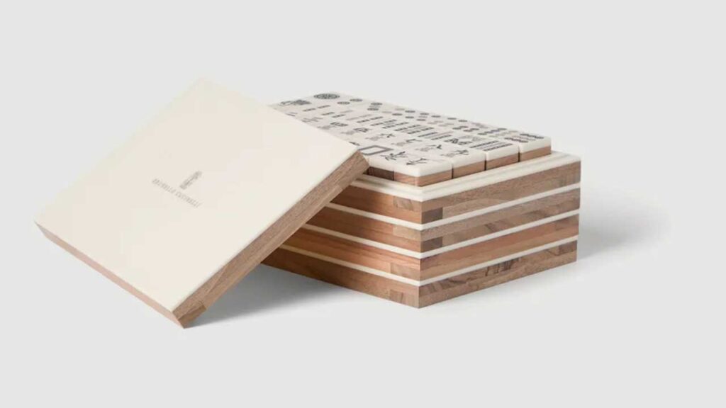 Brunello Cucinelli Walnut Wood, Krion® and Brass Mahjong Set; $15,200. SHOP NOW.