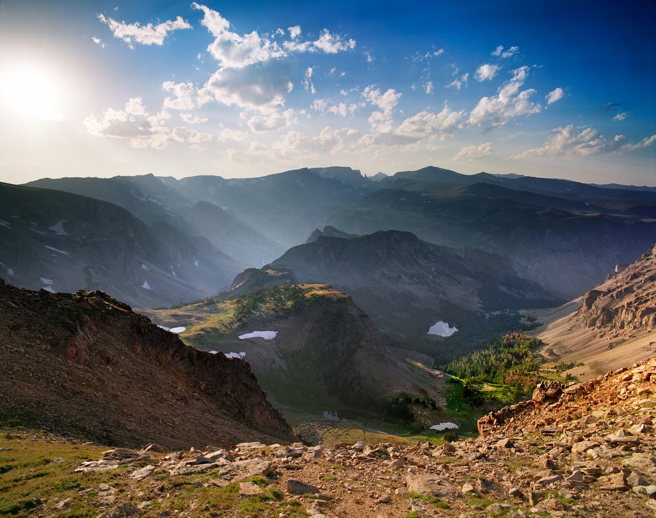 The 11,000 foot summit of Beartooth Pass along the Beartooth Highway offers spectacular views of surrounding mountain peaks and valleys.