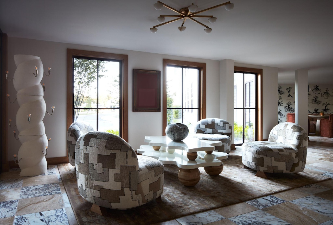 Pictured: Boldly designed Christian Sirano furniture pieces blend seamlessly into the check-in desk lobby of the Delamar Westport; Photo credit: Tim Lenz