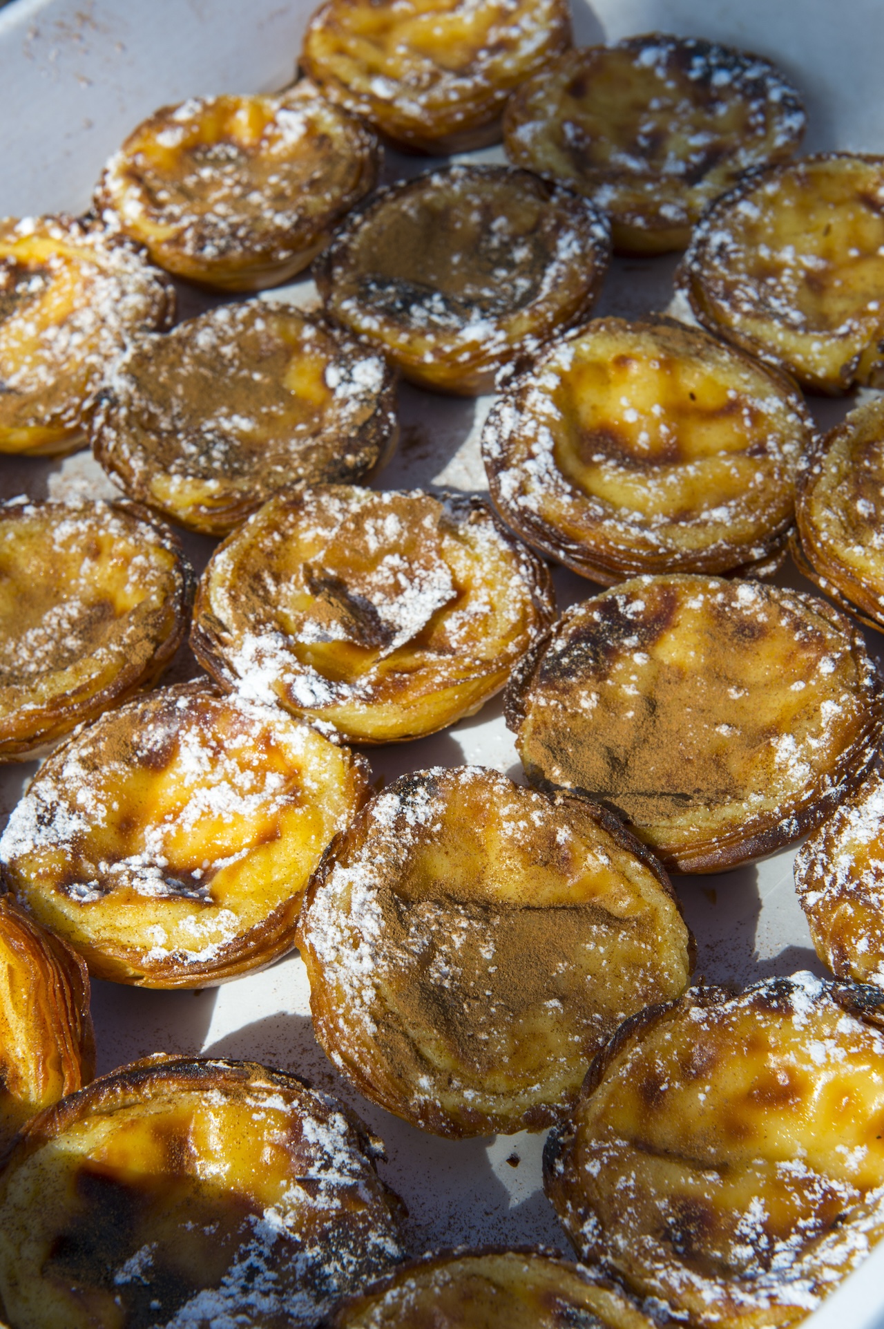 PORTUGAL - 2015/04/04: Close-up of Pastel de nata, which is a Portuguese egg tart pastry, in Lisbon, the capital city of Portugal. (Photo by Wolfgang Kaehler/LightRocket via Getty Images)