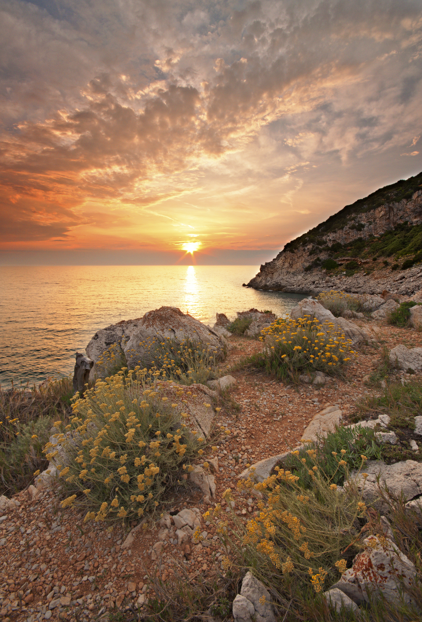 Punta Rossa beach at sunset in Italy.