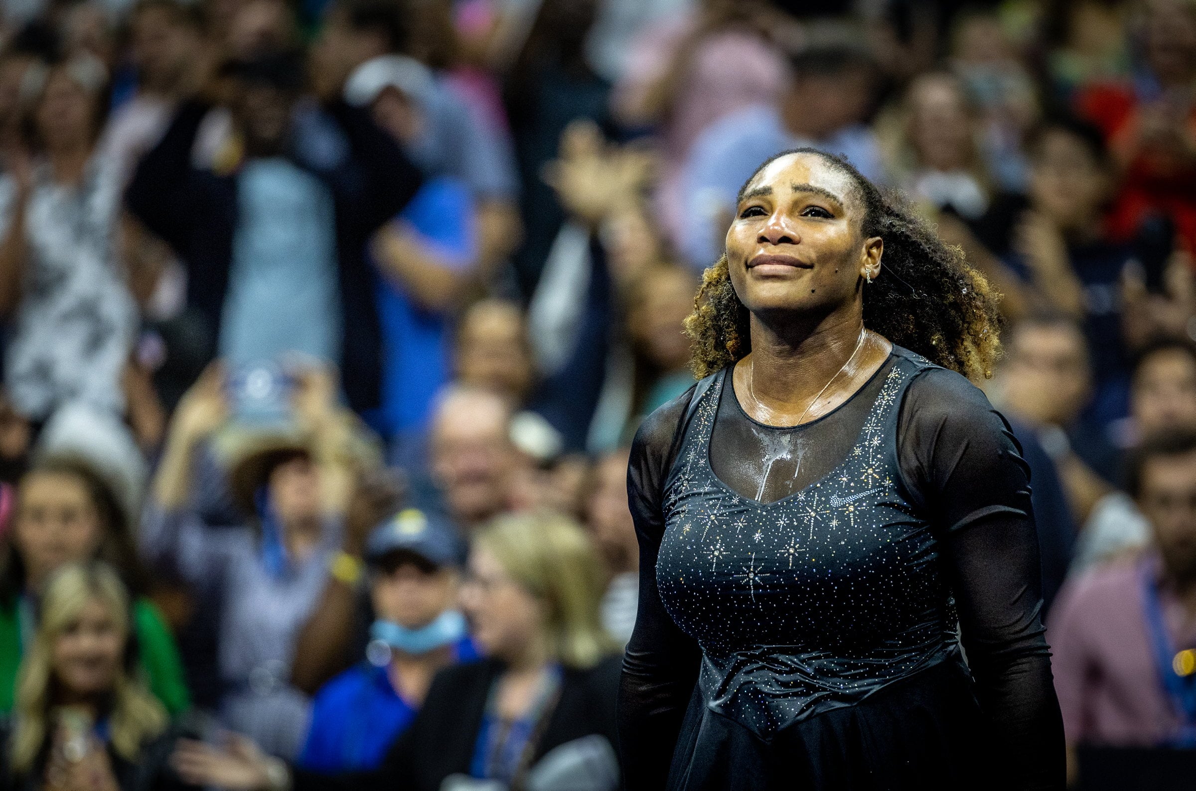 Tennis champion Serena Williams watches as crowd cheers after her final match against Ajla Tomljanovic