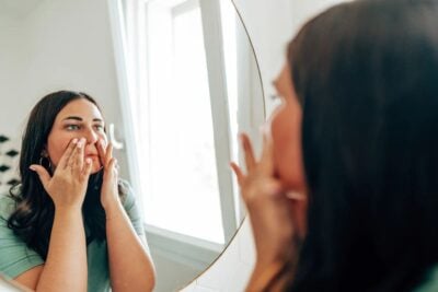 applying tinted moisturizer