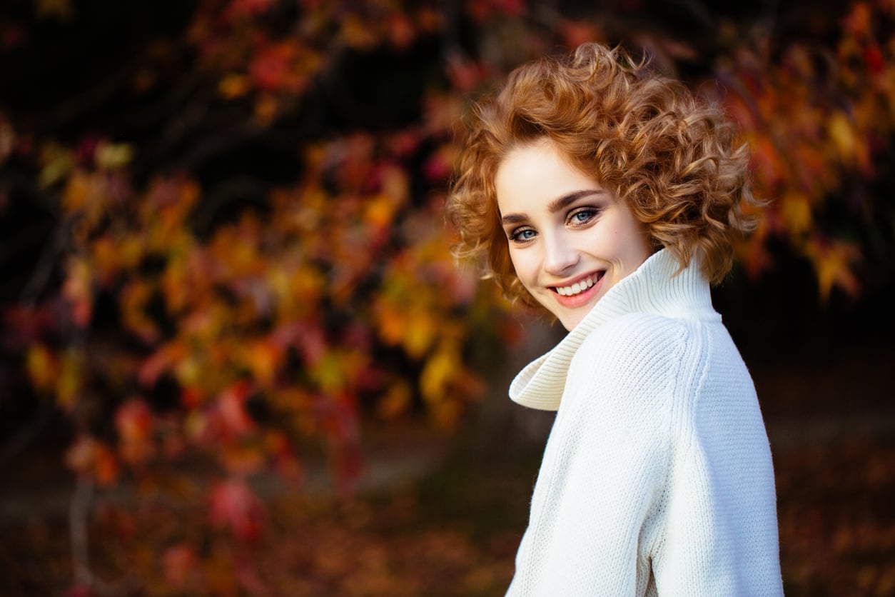 Your Hair Gets Frizzier in Fall for a Reason Nobody Mentions: These 7 Lightweight Hairstyles Fix It, Whatever Your Length or Texture ShutterStock -CoffeeAndMilk