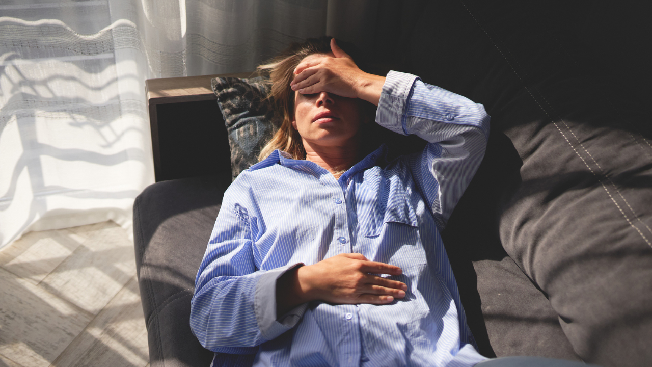 Woman tired on the couch