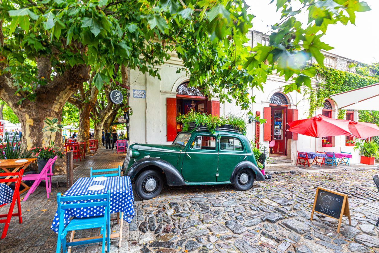 iStock @Kevin Lee Veiw of traditional stone street in the historic quarter of Colonia, Decorated with a classic car, Uruguay, UNESCO world heritage site.