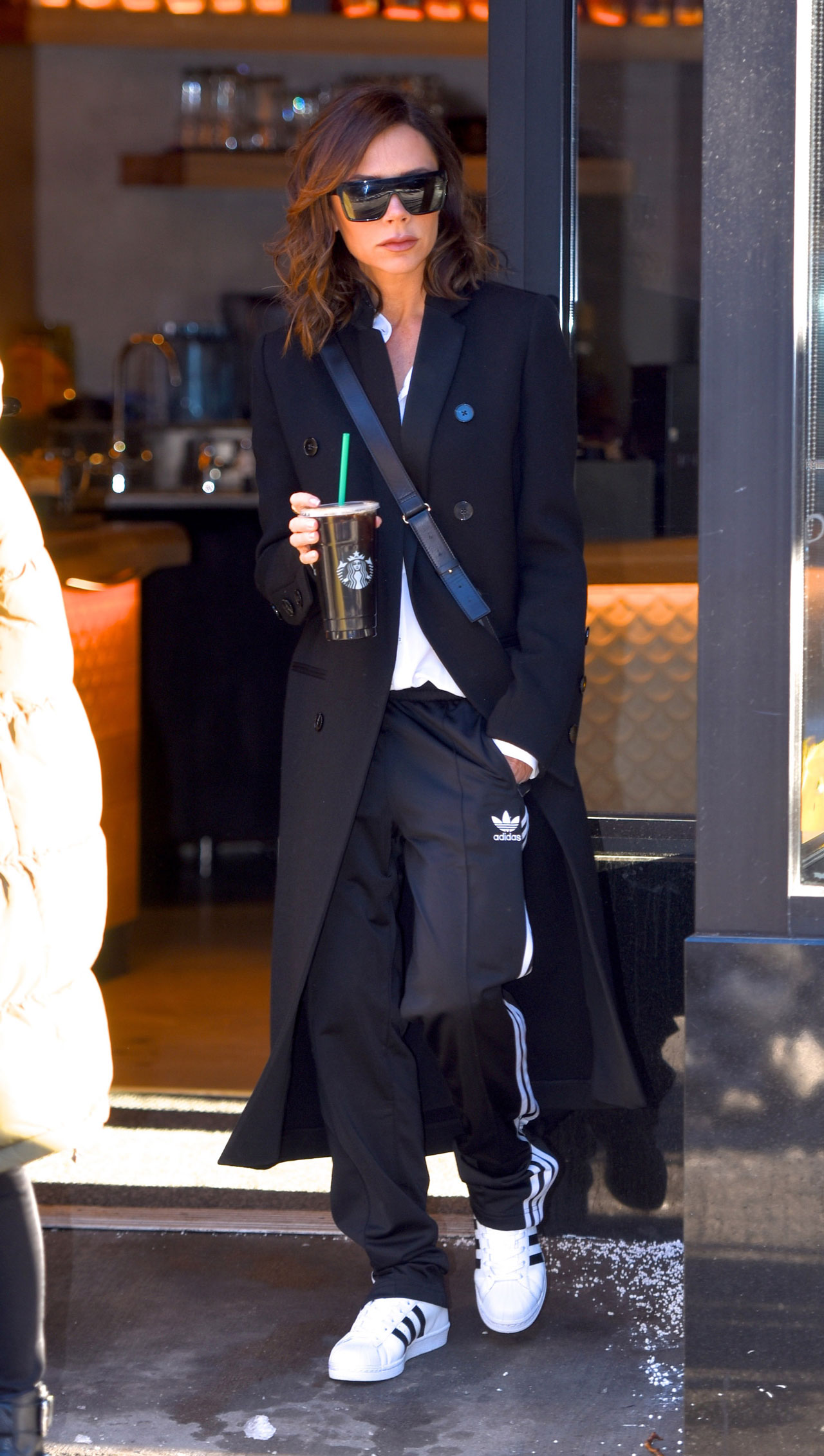 We finally know why Victoria Beckham has fallen in love with white trainers